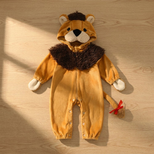 Little Lion suit laid flat on a sunny wood floor, showing the mane hood, mitten hands and tail with a red bow